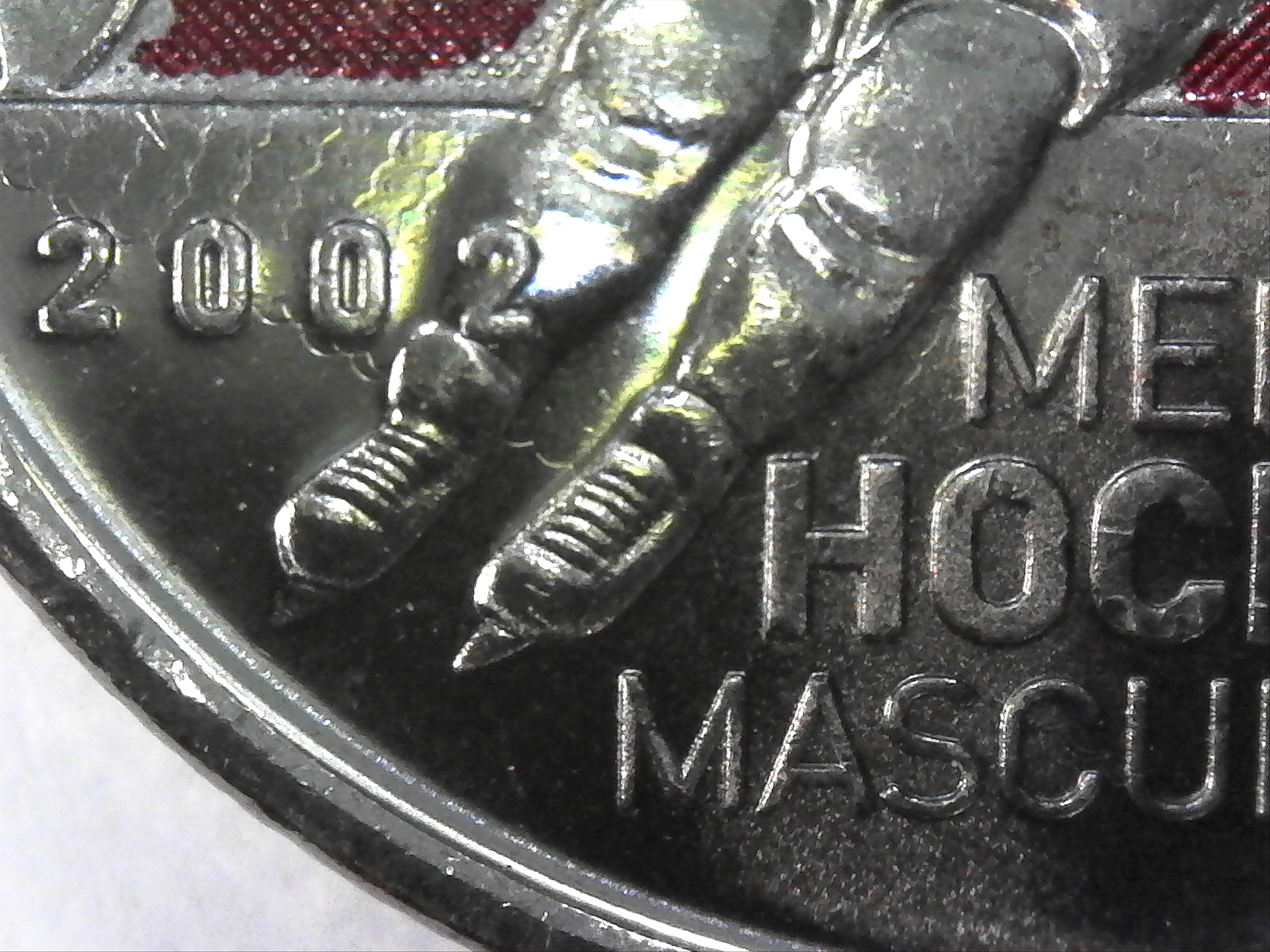2009 25¢ - Mens Hockey, raised 2.jpg